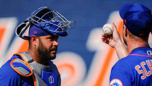 Feb 17, 2023; Port St. Lucie, FL, USA; New York Mets starting pitcher Max Scherzer (21) talks to New York Mets catcher Omar Narvaez (2) during spring training workouts.